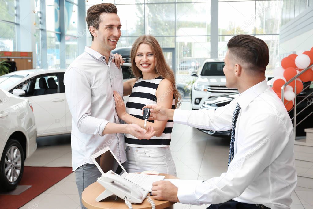 Young couple buying car