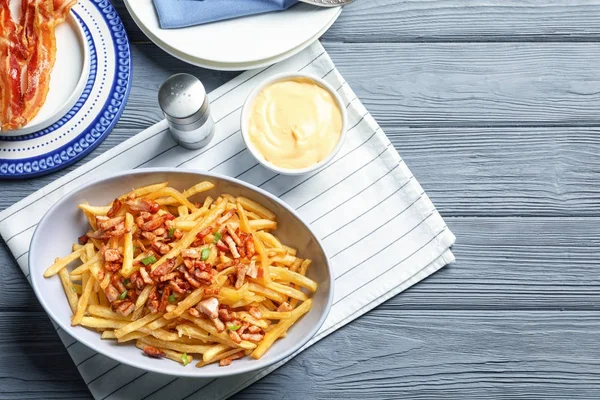 Plate with french fries and bacon — Stock Photo, Image