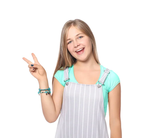 Roztomilý dospívající dívka ukazuje vítězství gesto na bílém pozadí — Stock fotografie