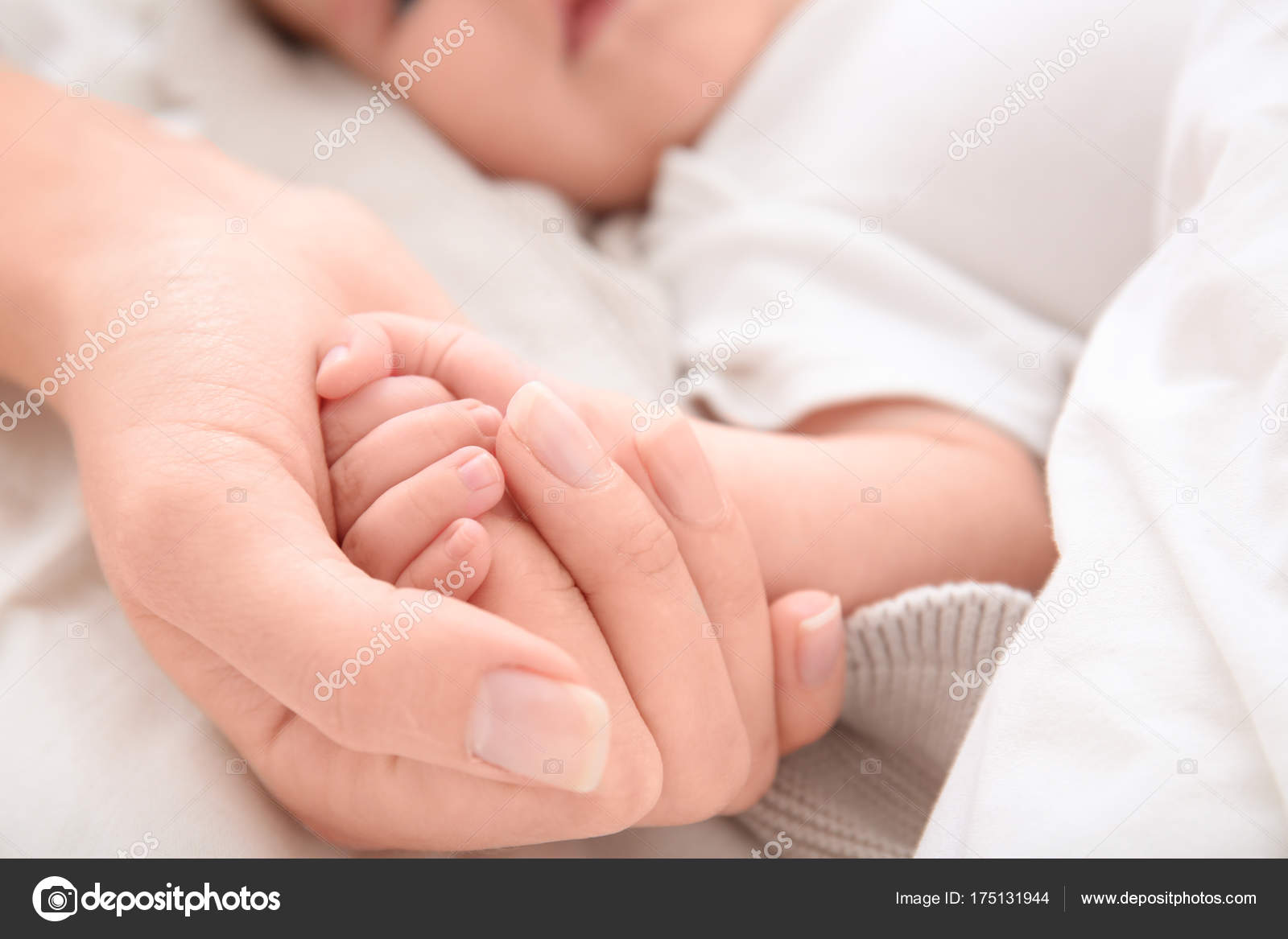 baby holding bed
