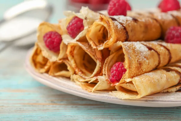 Plate with delicious rolled pancakes — Stock Photo, Image