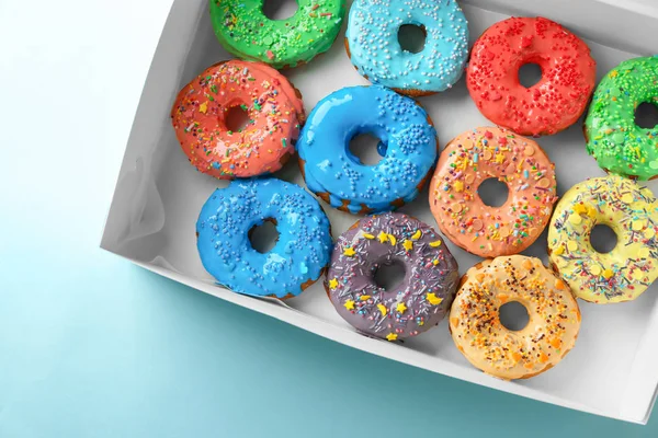 Tasty glazed donuts in box