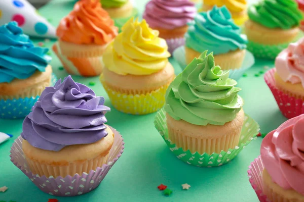 Tasty cupcakes on color background — Stock Photo, Image