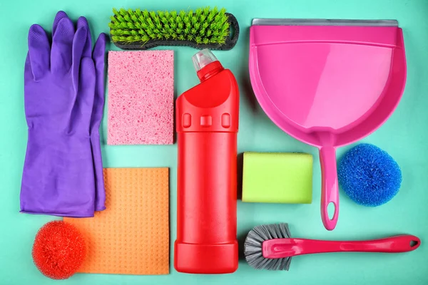 Cleaning supplies on color background — Stock Photo, Image