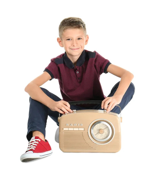 Adorable niño con radio vintage sobre fondo blanco — Foto de Stock