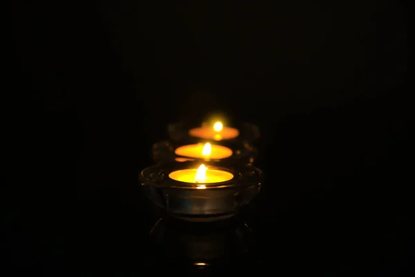 Burning candles on dark background — Stock Photo, Image