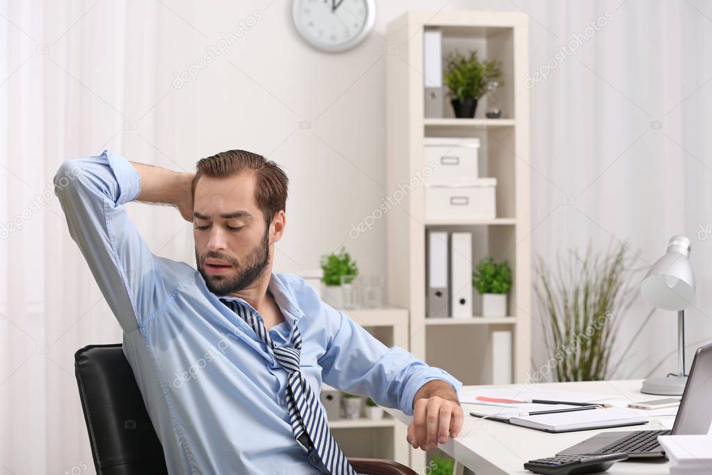 man sweating in office