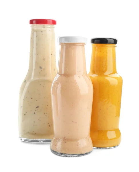 Bottles with different sauces for salad — Stock Photo, Image