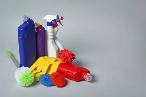 Cleaning supplies on grey background — Stock Photo, Image