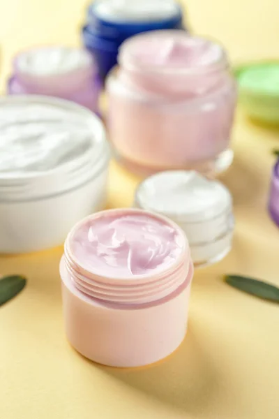 Jars of body cream on  background — Stock Photo, Image