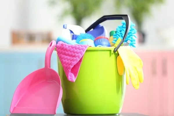 Cleaning supplies in plastic bucket — Stock Photo, Image