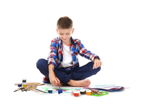 Cute little boy painting against white background — Stock Photo, Image
