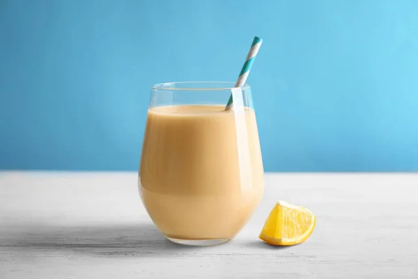 Glass with orange milkshake — Stock Photo, Image
