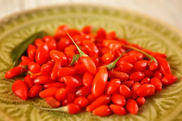 Fresh goji berries on plate — Stock Photo, Image