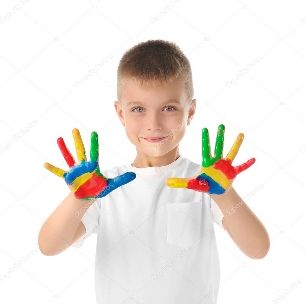 little boy with hands in paint
