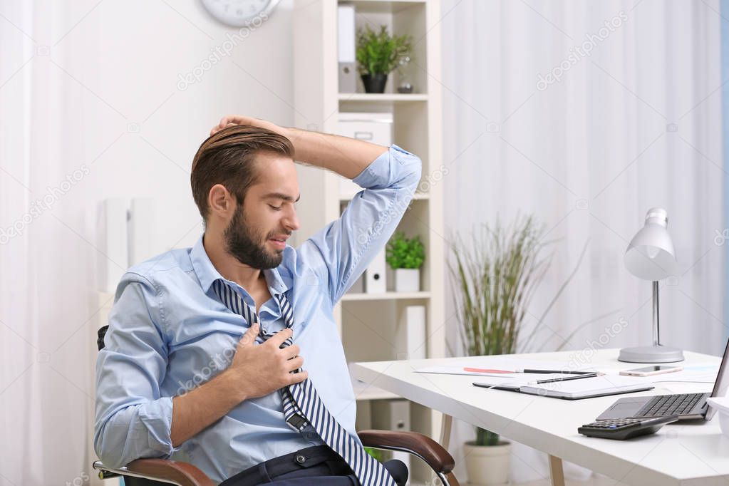 man sweating in office