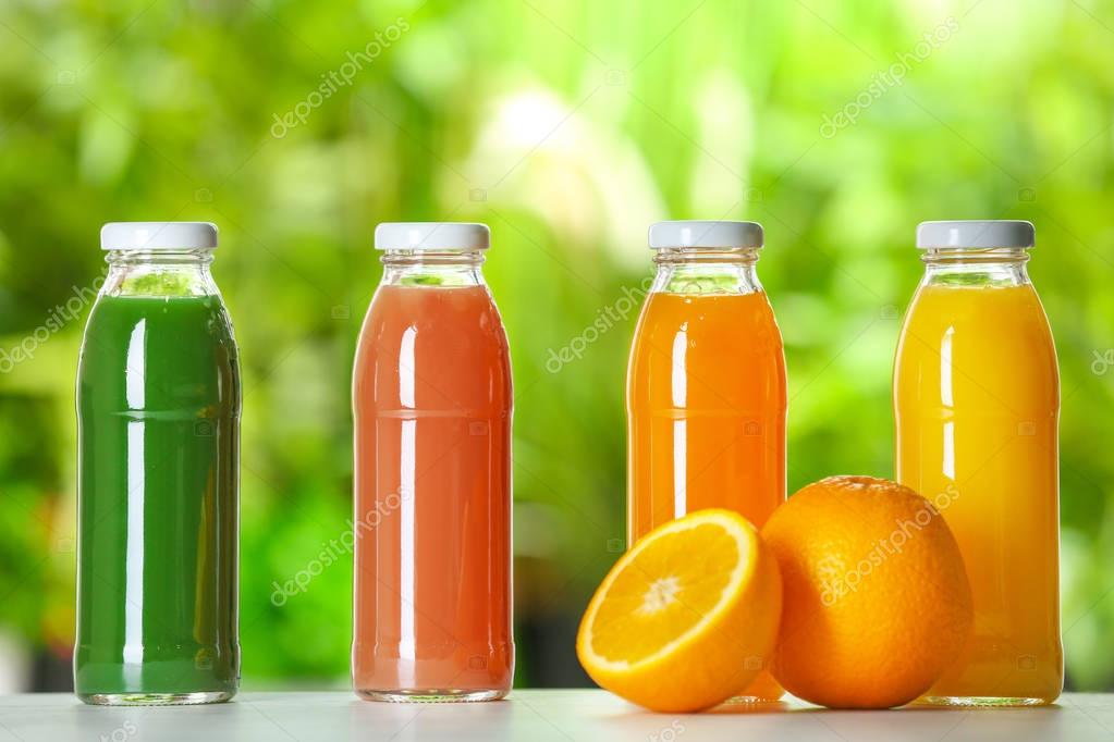 Download Bottles with fresh juices — Stock Photo © belchonock #175177470