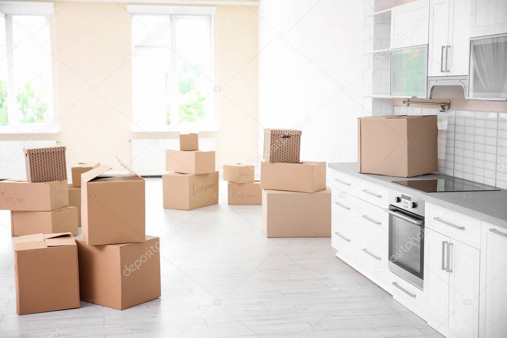 Cardboard boxes in kitchen of new apartment