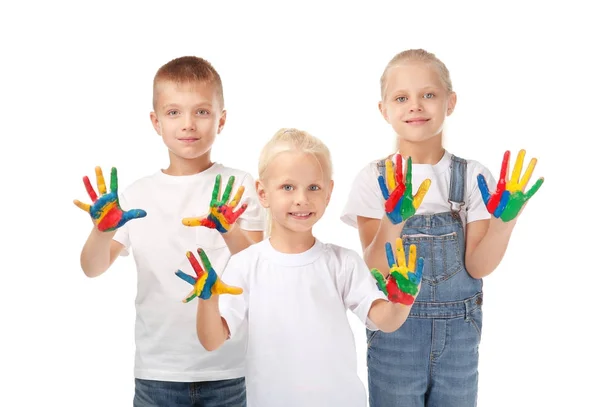 Lindos niños pequeños con manos en pintura sobre fondo blanco —  Fotos de Stock
