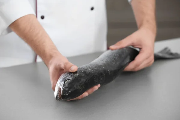 Chef with fresh salmon — Stock Photo, Image