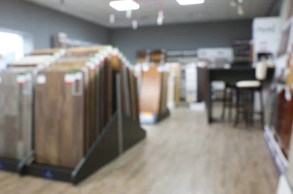 Blurred view of flooring samples in shop