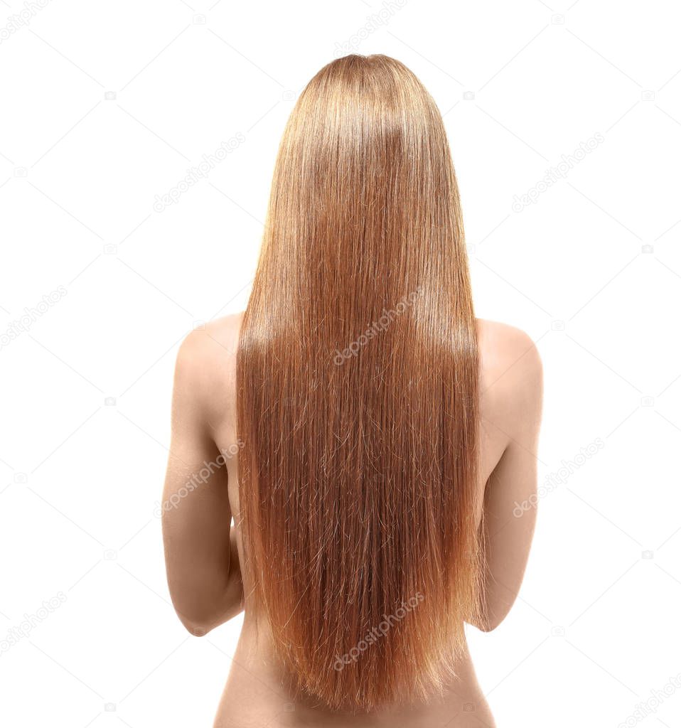 Young woman with beautiful long hair of caramel color on white background