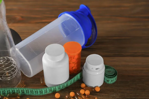 Vitamins, measuring tape and shaker — Stock Photo, Image