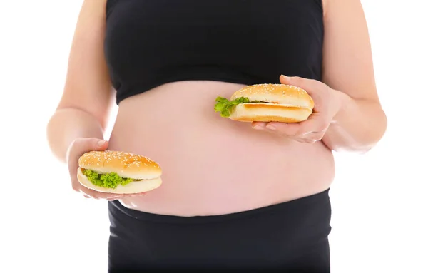 Mujer con sobrepeso sosteniendo hamburguesas — Foto de Stock