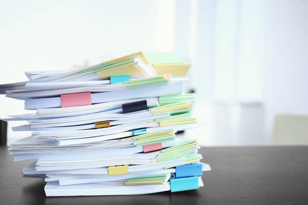 Stack of documents on table 