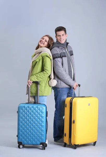 Happy tourists with suitcases