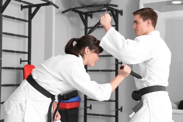 Man and woman practicing martial arts — Stock Photo, Image