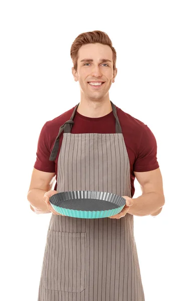 Young man with cake pan Stock Photo