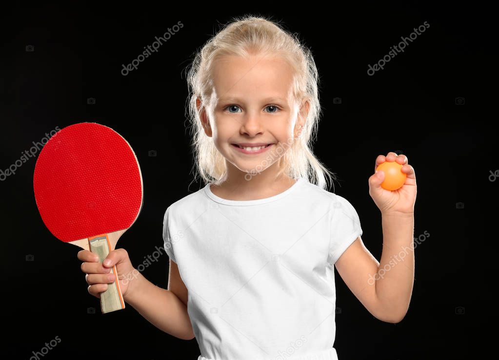 little girl with tennis racket and ball 