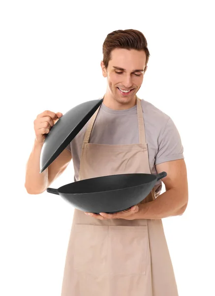 Молодой человек с сковородкой — стоковое фото
