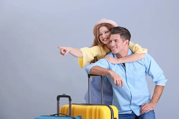 Happy tourists with suitcases