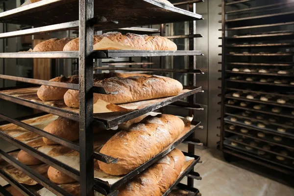 Loaves of bread on shelving — Stock Photo, Image