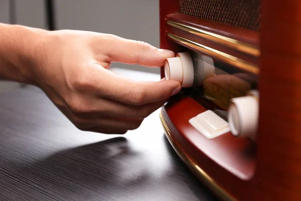 Person tuning retro radio, closeup — Stock Photo, Image