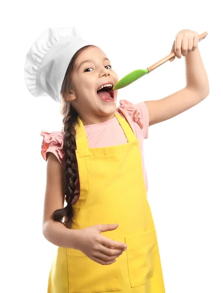Linda chica en sombrero de chef con espátula — Foto de Stock