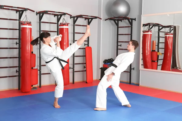 Man and woman practicing karate — Stock Photo, Image