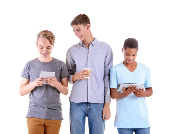 Teenagers with tablet computers on white background — Stock Photo, Image