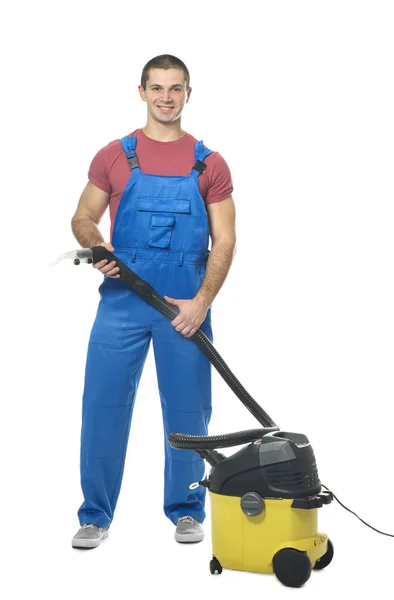 Young man with vacuum cleaner — Stock Photo, Image