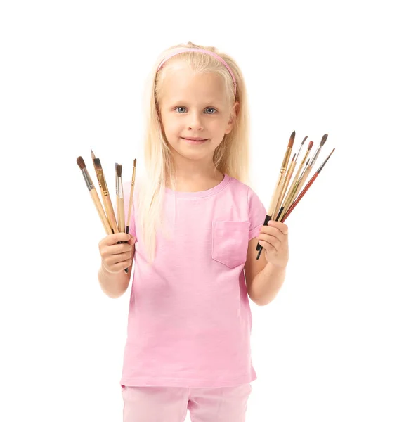 Cute little girl with brushes — Stock Photo, Image