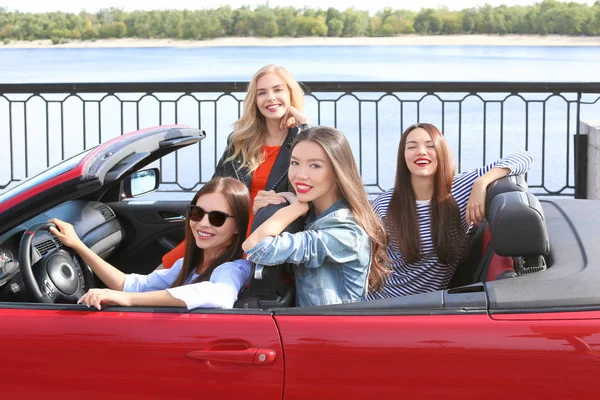 Beautiful young women in cabriolet outdoors — Stock Photo, Image