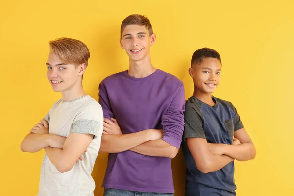 Cute teenagers on color background — Stock Photo, Image