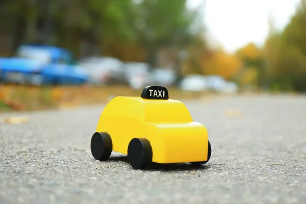 Yellow toy taxi cab