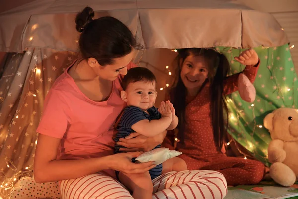 Young mother with cute kids playing — Stock Photo, Image