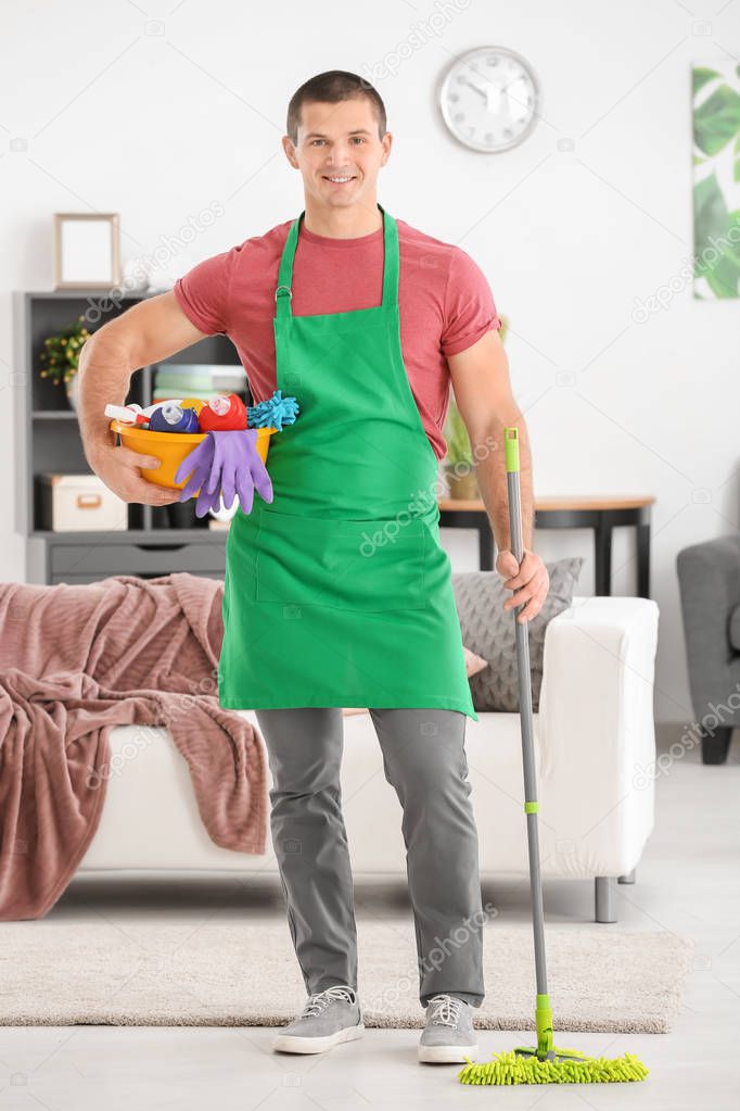 Young man with cleaning supplies