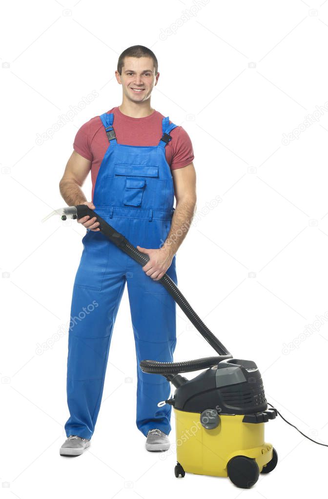 Young man with vacuum cleaner