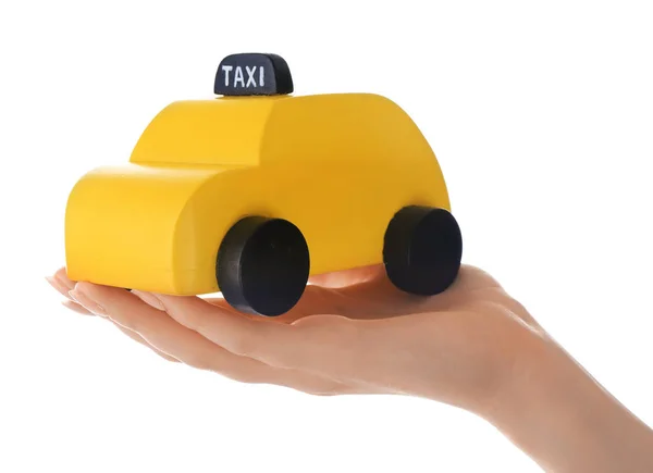 Woman holding toy taxi cab — Stock Photo, Image