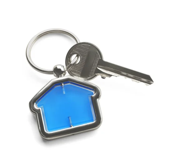 Key with trinket in shape of house — Stock Photo, Image